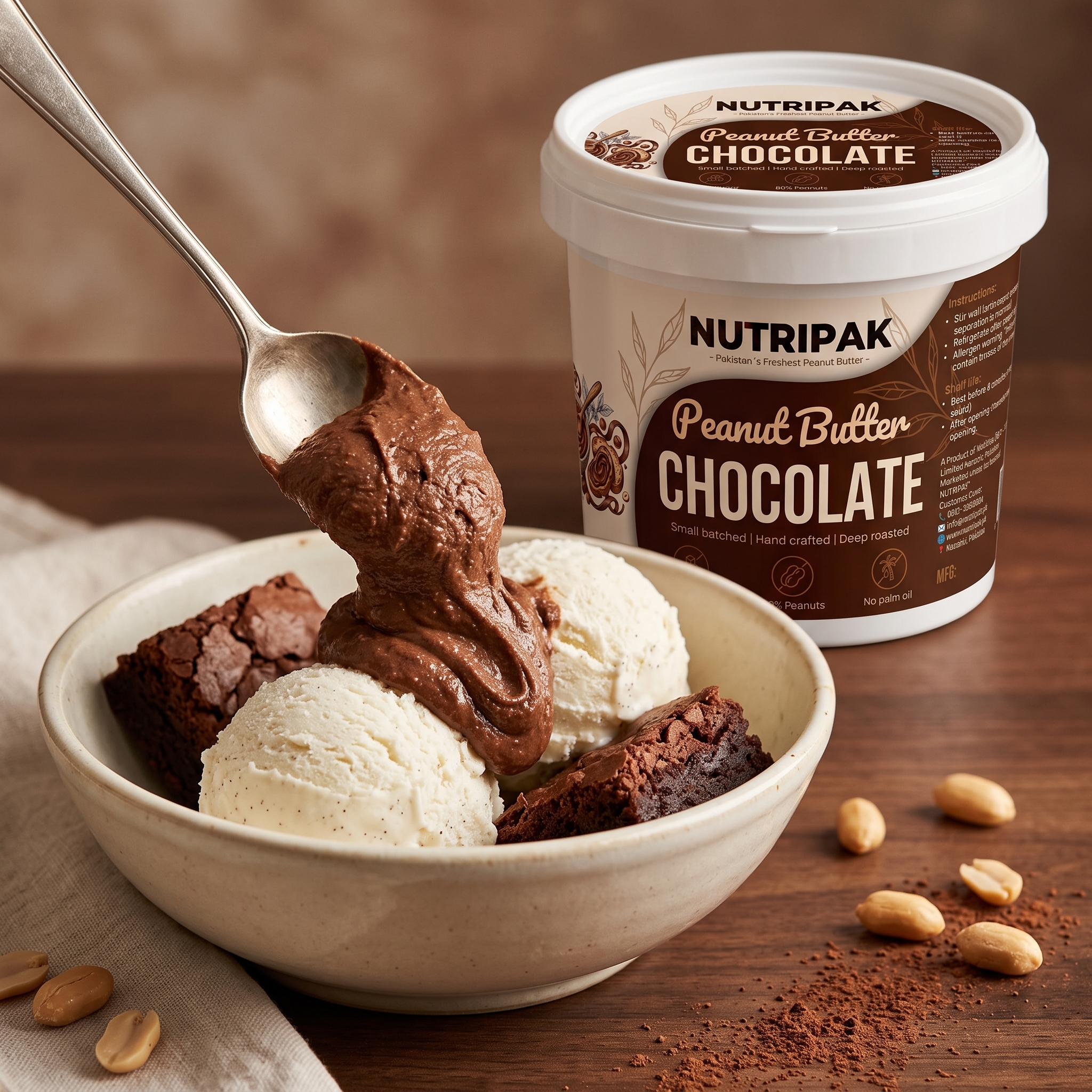 Chocolate peanut butter as dessert topping over vanilla ice cream and brownies